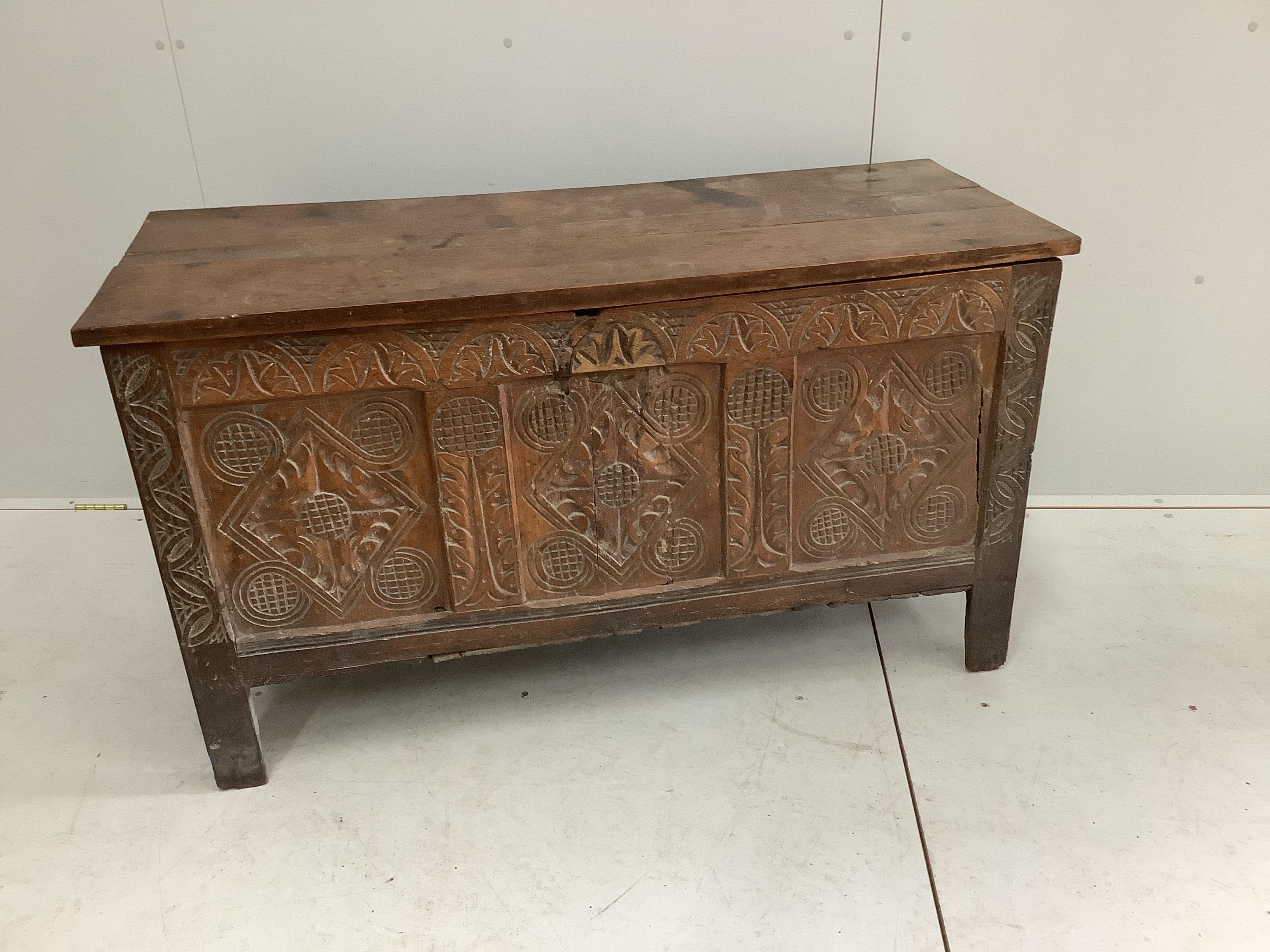 A carved coffer, width 127cm, depth 50cm, height 72cm